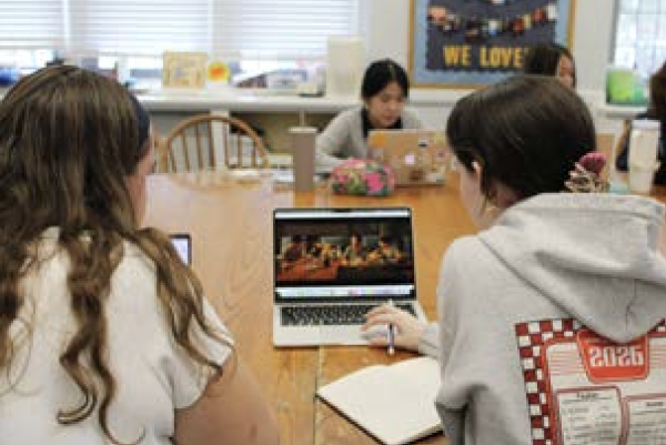 Sienna Yocom ‘26 and Piper Skoglund ‘26 watching and taking notes on Parasite.
